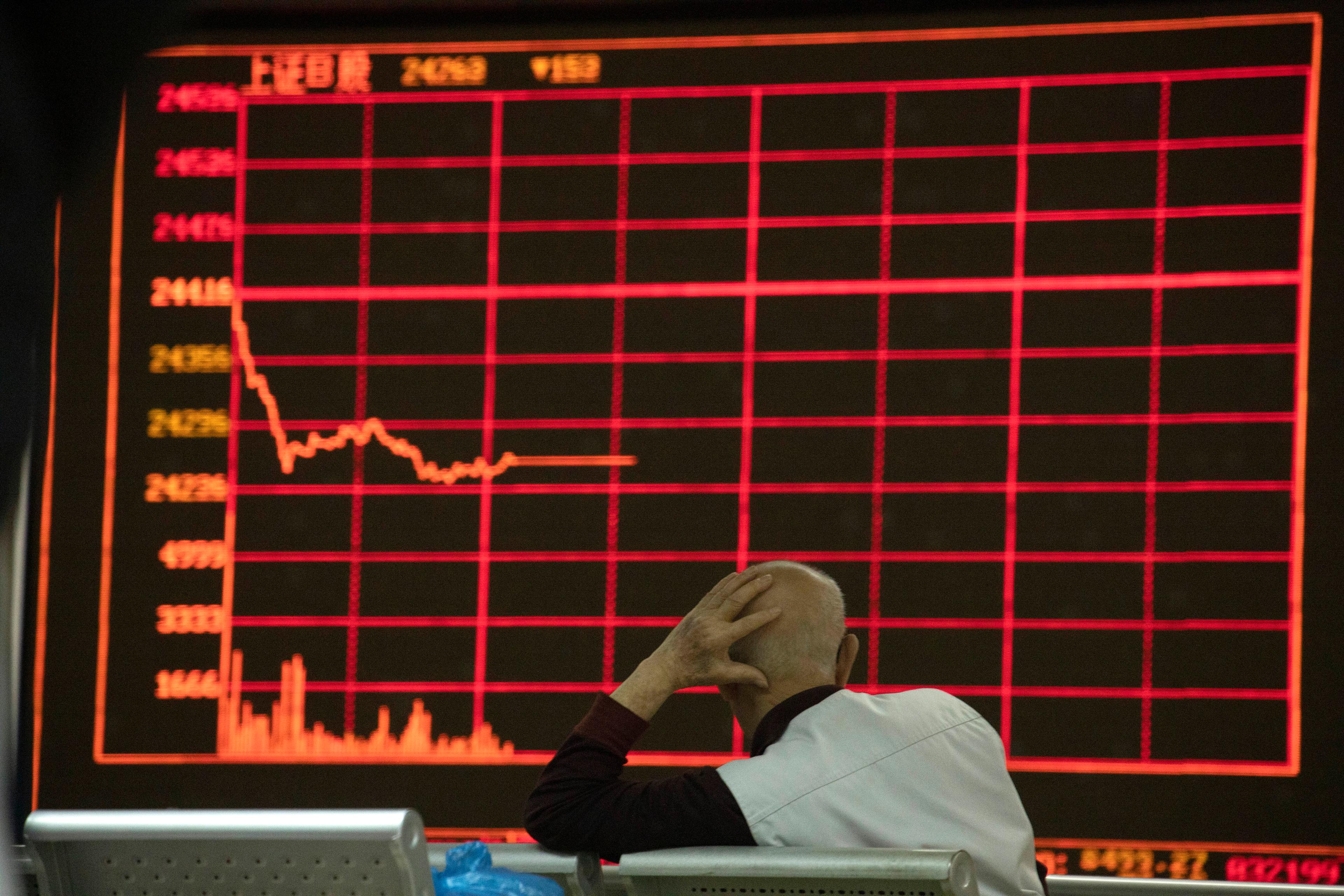 Börserna pekade nedåt i Hongkong i den tidiga tisdagshandeln. Foto: Ng Han Guan/AP/TT