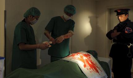 Dramatisering av organstölder på Falun Gong-utövare i Kina. Foto: Getty Images. Arkivbild