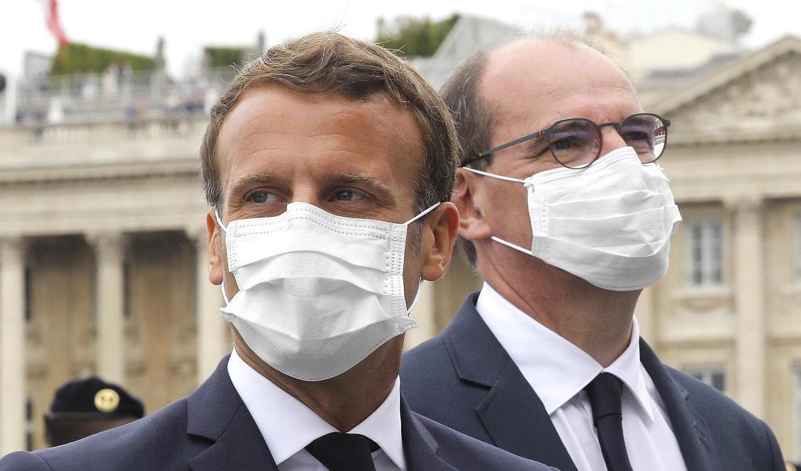 Frankrikes president Emmanuel Macron och premiärminister Jean Castex i munskydd under det franska nationaldagsfirandet tidigare i veckan. Foto: Ludovic Marin/AP/TT