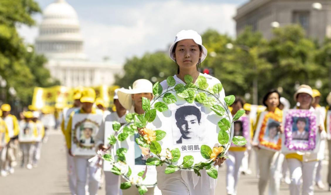 Falun Gong-utövare går i parad i Washington D.C. 20 år efter att förföljelsen av Falun Gong startade i Kina, den 18 juli 2019. Foto: Samira Bouaou/Epoch Times
