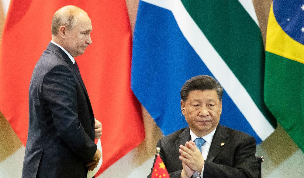 Kinas president Xi Jinping och Rysslands president Vladimir Putin deltar i ett möte under BRICS-toppmötet i Brasilia, Brasilia, den 14 november 2019. Foto: Pavel Golovkin/Pool/ AFP via Getty Images