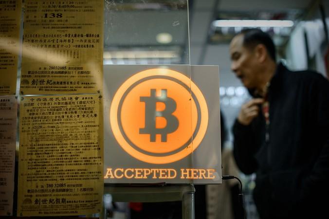 Det är aktiviteter i Kina som nu åter driver upp priset på Bitcoin. Bilden från öppnandet av den första Bitcoin-butiken i Hong Kong, i början av 2014. (Foto: Philippe Lopez/AFP/Getty Images)