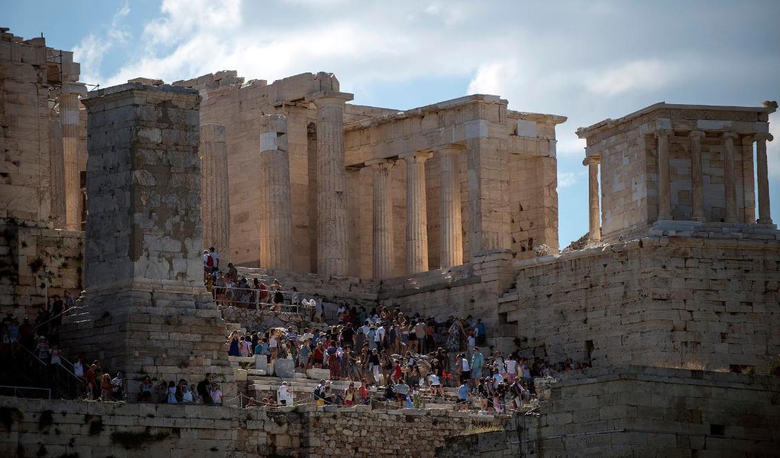 Turister vid templet Parthenon på Akropolis i Aten i Grekland den 20 juli 2018. Foto: Angelos Tzortzinis/AFP/Getty Images