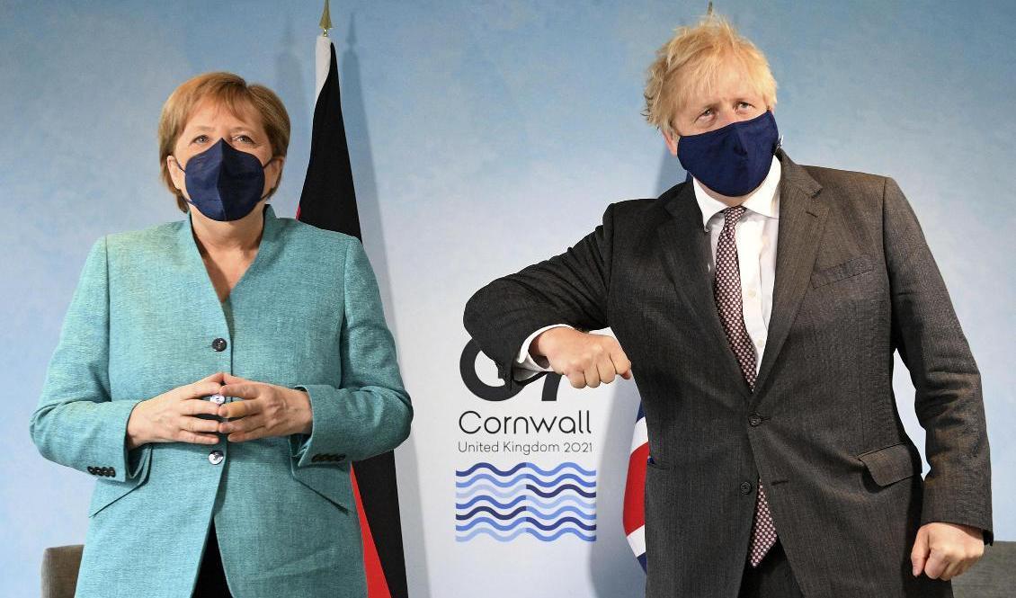 Tysklands förbundskansler Angela Merkel och Storbritanniens premiärminister Boris Johnson bid G7-mötet i brittiska Cornwall. Foto: Stefan Rousseau/AP/TT